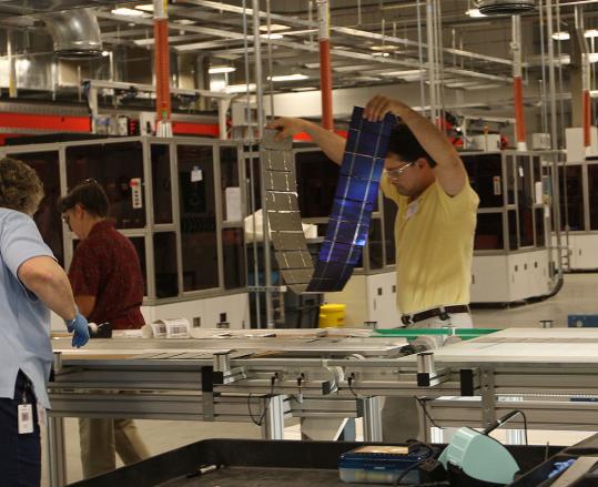 Evergreen Solar, which manufactures at its Devens plant the wafers and cells used in solar panels, will move the final assembly of those panels to a new plant in China.