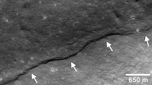 Image showing a thrust fault having pushed crustal materials (arrows) up the side of the f...