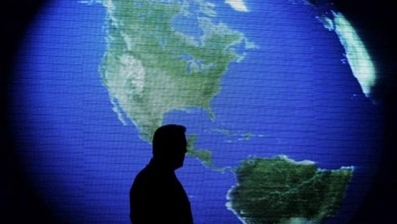 FILE: Former U.S. Vice President and environmentalist Al Gore is silhouetted against an image of the earth during his June 8 talk about climate change in Manila, Philippines. Gore said at a green energy business conference in Athens that lobbyists have wrongly kept alive the ethanol program he once touted.
