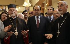 Iraqi Prime Minister Nouri al-Maliki, center, meets with Christian leaders Tuesday.