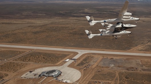 VSS Enterprise flies over the runway dedication ceremony at Spaceport America, New Mexico ...