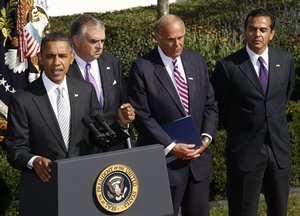 President Barack Obama speaks to reporters in the Rose Garden to highlight a new report on the impact of his $50 billion infrastructure-investment proposal, Monday, Oct. 11, 2010 at the White House in Washington. On stage with Obama are from left to right, Secretary of Transportation Ray LaHood, Gov. Ed Rendell, D-Penn., and Los Angeles Mayor Antonio Villaraigosa.