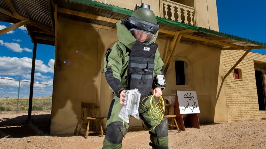 Airman 1st Class Patrick Connolly of Dayton, Ohio, demonstrates the placement of the water...