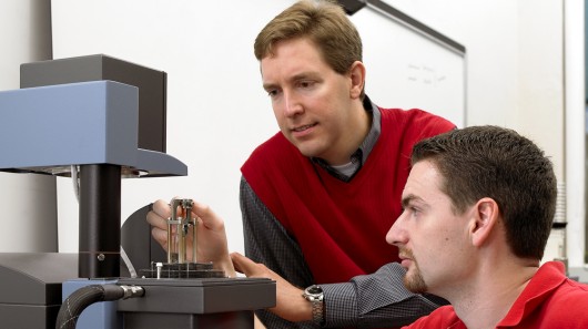 Michael Kessler (left) and former Iowa State doctoral student Will Goertzen use a dynamic ...