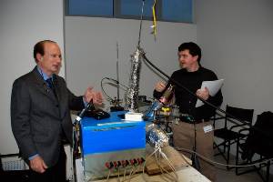 Andrea Rossi, left, demonstrates the 10 kW heat generating device during the Italian press conference January 14, 2011.Photo by Daniele Passerini.