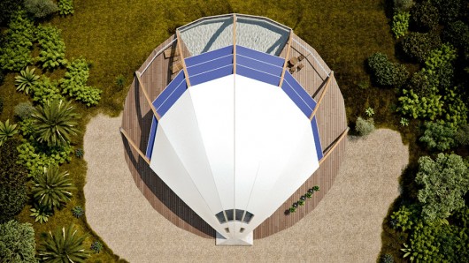 A rainwater storage tank sits at the base of the northern pillar