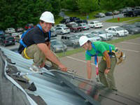 installing solar panels by Katie Romanov