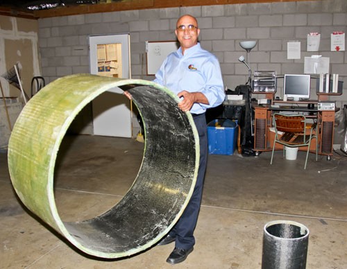 Prof. Ehsani demonstrating the light weight of the pipe (Photo: University of Arizona)