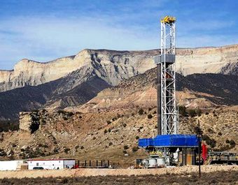 A drilling rig stands over a natural gas well in Colorado