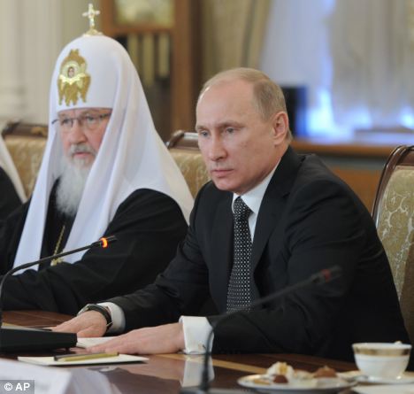 Powers of veto: Mr Putin, discussed Russia's policy on Syria with religious leaders at the St Daniel Monastery in Moscow