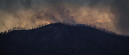 People return to charred cities after Colorado wildfires Photo: Adrees Latif