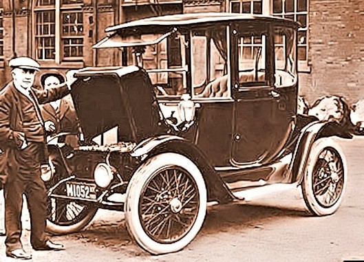 Thomas Edison examining a 1913 Detroit Electric car containing his nickel-iron batteries (...