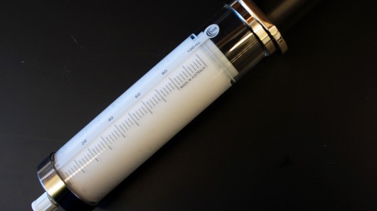 A syringe containing the oxygen microparticle solution 