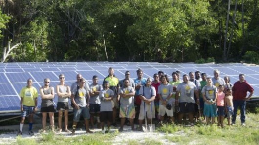 Workers install a solar array in Tokelau, an island nation that will be powered with renew...