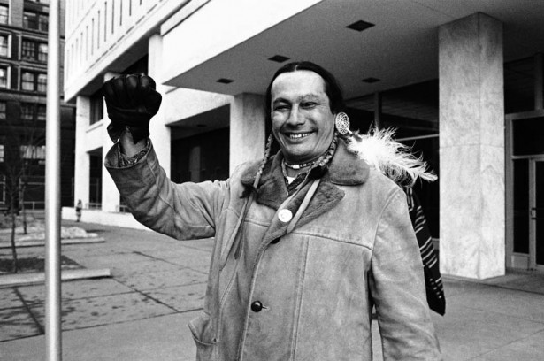 American Indian Movement leader Russell Means leaves federal building, Wednesday, January 24, 1974 in St. Paul one day after winning primary election for Oglala Sioux tribal president in South Dakota. He is on trial here in regards to the 1973 takeover of Wounded Knee, South Dakota.