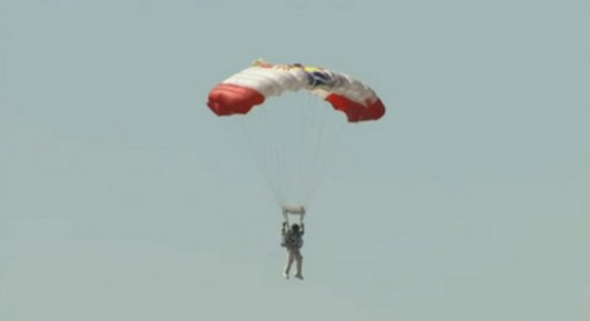 Felix Baumgartner glides back to Earth following a nearly flawless jump from an altitude o...