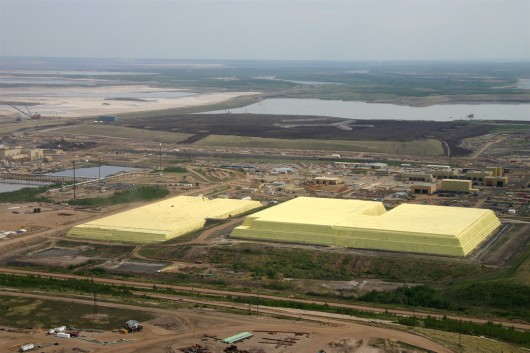 A sulfur stockpile at the processing facilities of Syncrude in Alberta, Canada (Photo: Dav...