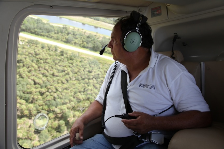 Willie Johns looks out from a helicopter flying over the reservation. (Courtesy Peter B. Gallagher)
