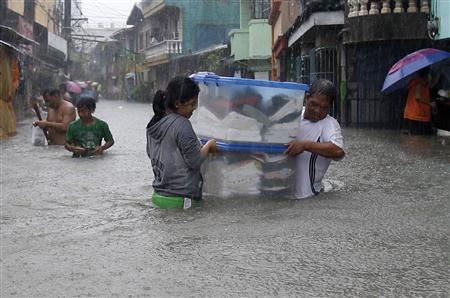 Monsoon rains swamp half of Philippine capital, killing seven Photo: Romeo Ranoco