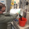 PNNL lab manager Tom Hart, pouring some of the unprocessed algae 