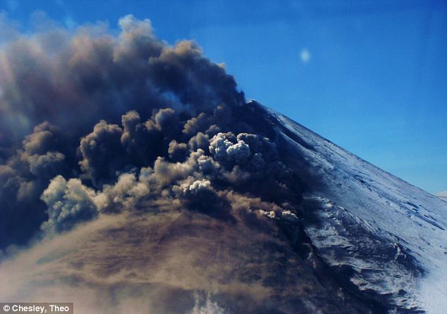 Big brothers: The newly discovered volcanoes stand in contrast to their showier cousins tot he west, like Pavlof Volcano, pictured, which made headlines with its moodiness in recent weeks