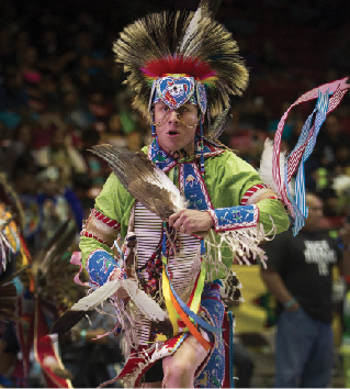 A chicken dancer performs on Saturday night. The Gathering of Nations is so popular among elite pow wow dancers that many of the usual categories are broken down in subcategoriesto the delight of dancersoften by region, style or whether it is contemporary or not.