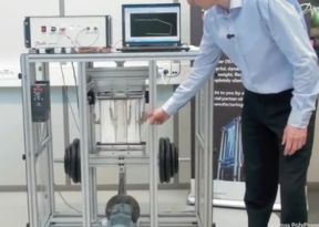 Danfoss president Michael Hamann demonstrates the DEAP mateerial undergoing a stretch test.