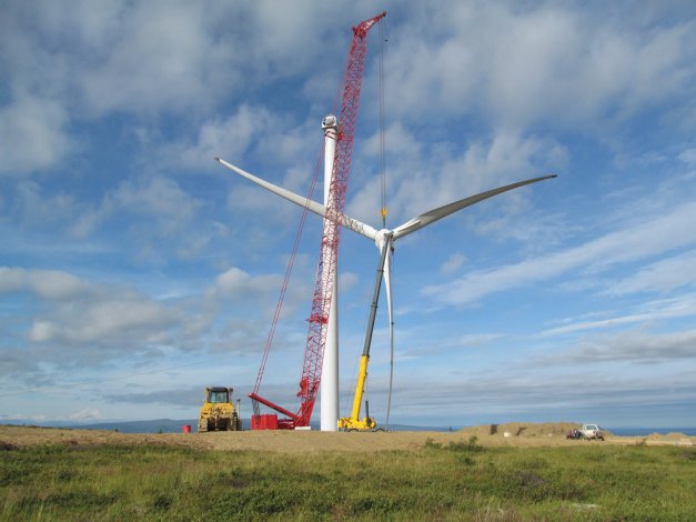A rotor for one of the 12 wind turbines is moved into position at the Eva Creek wind project near Healy. The project began generating power last fall, and the Golden Valley Electric Association estimates it will offset some $4 million in fuel costs for its members over the year.