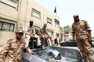 Anti-Gaddafi gunmen surround second Libya ministry Anti-Gaddafi gunmen surround second Libya ministry