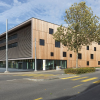 Thanks to the wood-panel facades the building would pass for a contemporary office complex...
