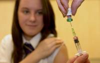 Photo - In this photo Thursday, April 25, 2013 Lucy Butler,15, getting ready to have her measles jab at All Saints School in Ingleby Barwick, Teesside, England, as a national vaccination catch-up campaign has been launched to curb a rise in measles cases in England. More than a decade ago, British parents refused to give measles shots to at least a million children because of a vaccine scare that raised the specter of autism. Now, health officials are scrambling to catch up and stop a growing epidemic of the contagious disease. (AP Photo/Owen Humphreys, PA) UNITED KINGDOM OUT - NO SALES - NO ARCHIVES