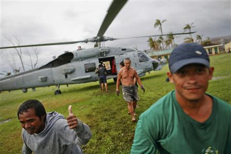 Villagers mob U.S. aid choppers as Philippine relief effort spreads Photo: Damir Sagolj