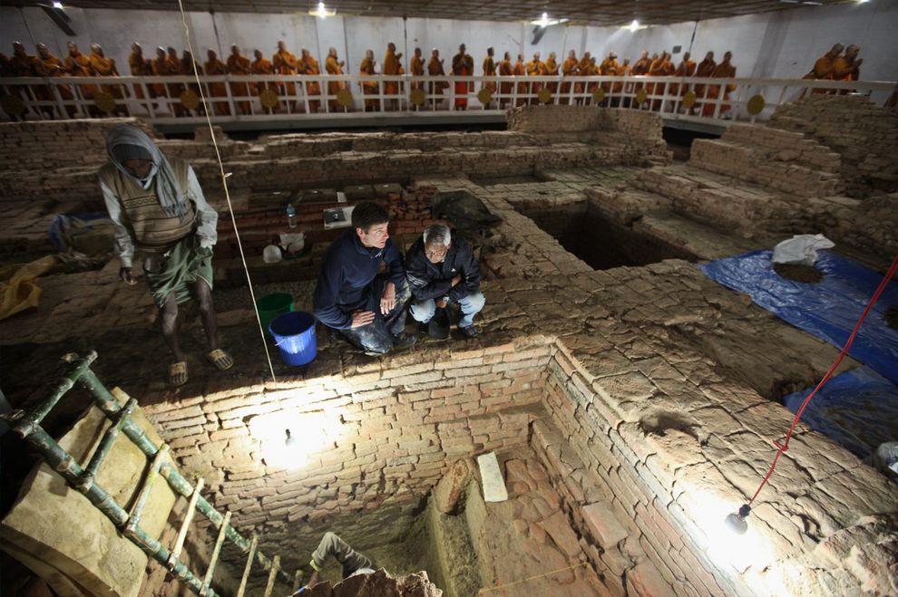 Photo of archaeologists Robin Coningham and Kosh Prasad Acharya directing excavations within the Maya Devi Temple, uncovering a series of ancient temples contemporary with the Buddha.