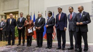 Chief negotiator Catherine Ashton and Iran's foreign minister announce agreement on Iran's nuclear program early on Sunday, November 24 in Geneva. (Getty Images/CNN)