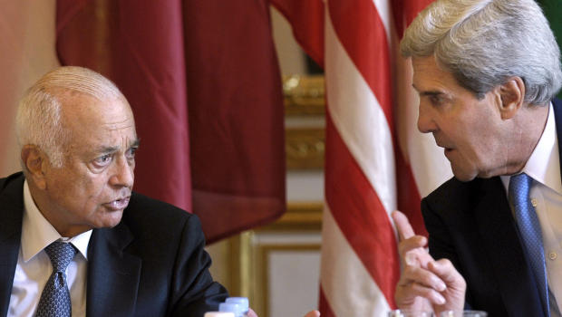 U.S. Secretary of State John Kerry (R) talks with Arab League Secretary General Nabil Elaraby before the start of a meeting with representatives of the Arab League at the United States Embassy in Paris, on September 8, 2013.