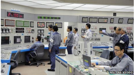 Workers of Kansai Electric Power Co's Ohi nuclear power plant monitor the restart of the No 3 unit in Ohi, Fukui prefecture, in this file photo taken by Kyodo on July 1, 2012