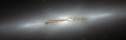 The NGC4710 galaxy as captured by the Hubble Space Telescope. The galaxy's core exhibits t...