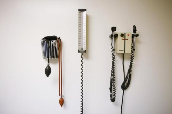 Devices used to take blood pressure, temperature, and examine eyes and ears rest on a wall inside of a doctor's office in New York March 22, 2010.  REUTERS/Lucas Jackson