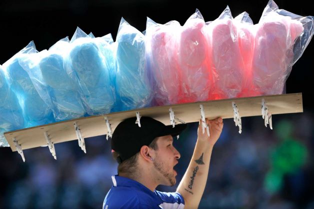 FILE - In this Sept. 8, 2013 file photo, a vendor sells cotton candy at Safeco field during a baseball game between the Tampa Bay Rays and the Seattle Mariners, in Seattle. A new study published Monday, Feb. 3, 2014 in the journal, JAMA Internal Medicine, says diets high in sugar are linked with increased risks for fatal heart disease, and it doesn't take that much extra sugar to boost the risk, anything more than a 20-ounce Mountain Dew soda a day. Photo: Ted S. Warren, AP / AP