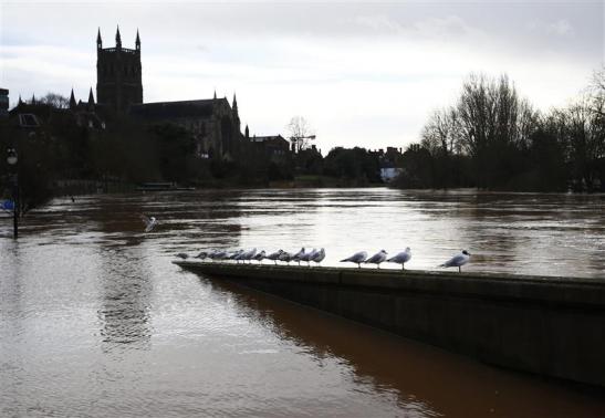 One dead as storms batter flooded Britain Photo: Darren Staples