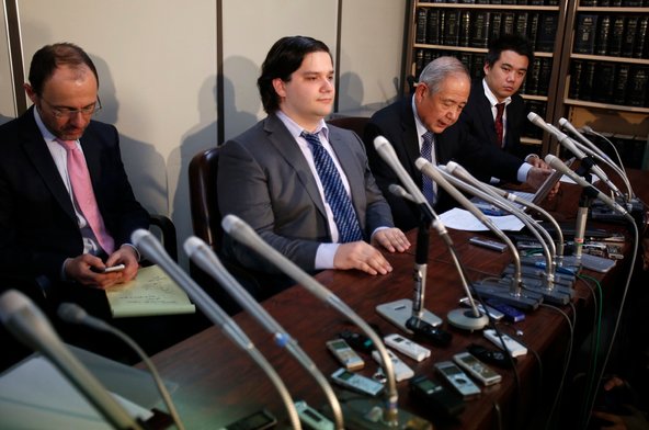 Mark Karpeles, second from left, attended a news conference after his company, Mt. Gox, filed for bankruptcy.