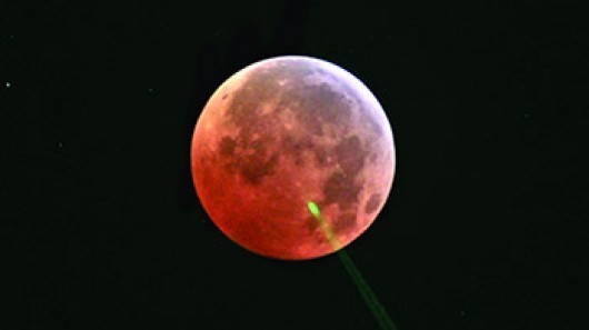 Lunar ranging laser pulse scattering off high terrestrial cloud during eclipse (Photo: NAS...