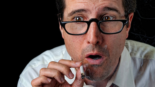 ["A businessman is surprised while taking a toke on his joint" on Shutterstock]