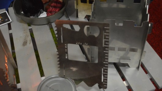 One of the stove's panels opens cans, pops bottle tops, cuts wood and more