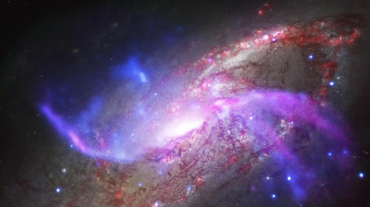 The spiral galaxy NGC 4258 is ejecting gas and high-energy particles in a spectacular disp...