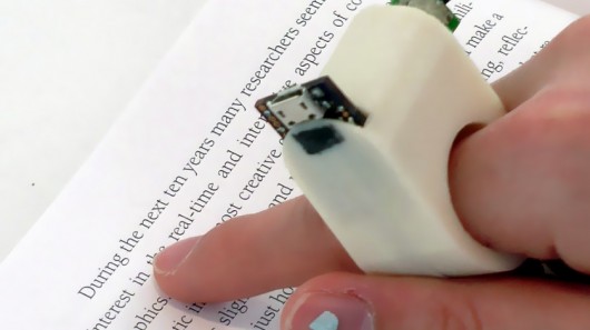 FingerReader uses a built-in camera to scan pieces of text, providing audio feedback to th...