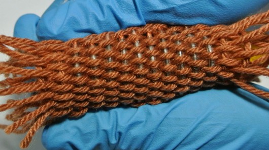 The fiber-shaped Li-ion batteries can be woven into textiles capable of powering wearable ...