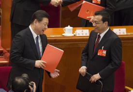 Chinese Premier Li Keqiang (on the right) and General Secretary of the Chinese Communist Party Xi Jinping (left) prepare to leave after the closing session of the National People Congress in the Great Hall of the People in Beijing.