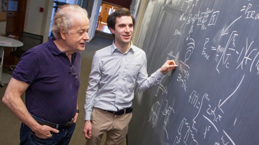 Harvard physicists Federico Capasso (left) and Steven J. Byrnes (right) are part of a team...