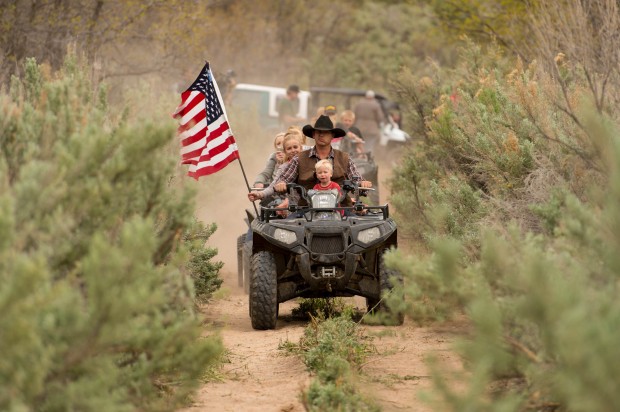 Ryan Bundy, son of the Nevada rancher Cliven Bundy, rides an ATV into Recapture Canyon north of Blanding, Utah on Saturday, May 10, 2014, in a protest against what demonstrators call the federal government's overreaching control of public lands. The area has been closed to motorized use since 2007 when an illegal trail was found that cuts through Ancestral Puebloan ruins. The canyon is open to hikers and horseback riders. (AP Photo/The Salt Lake Tribune, Trent Nelson)